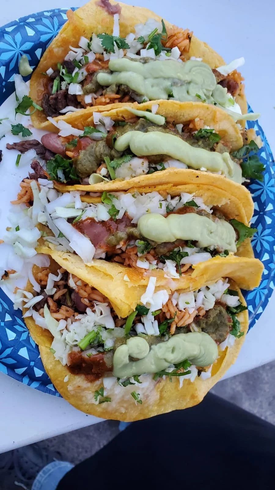 Plated street tacos with avocado salsa ready for wedding guests