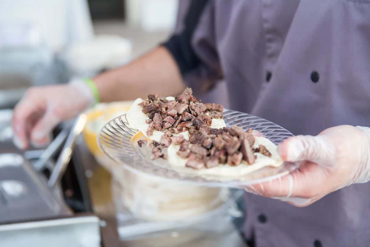 Taco Master plating mesquite-grilled carne asada tacos at a North Las Vegas event